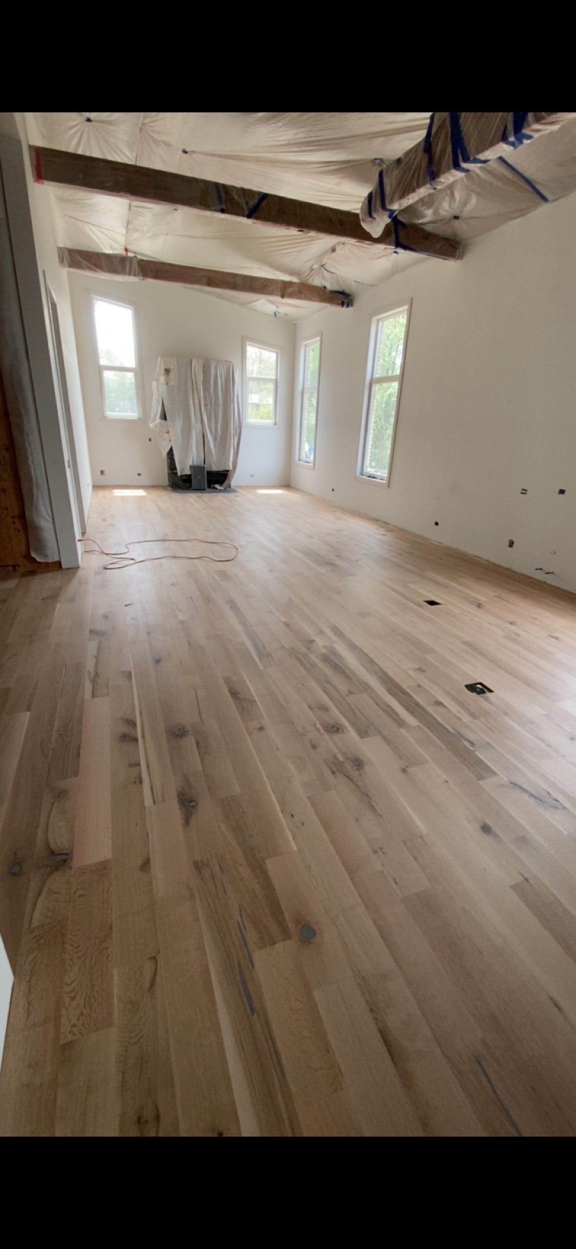 Wide view of finished dark hardwood flooring
