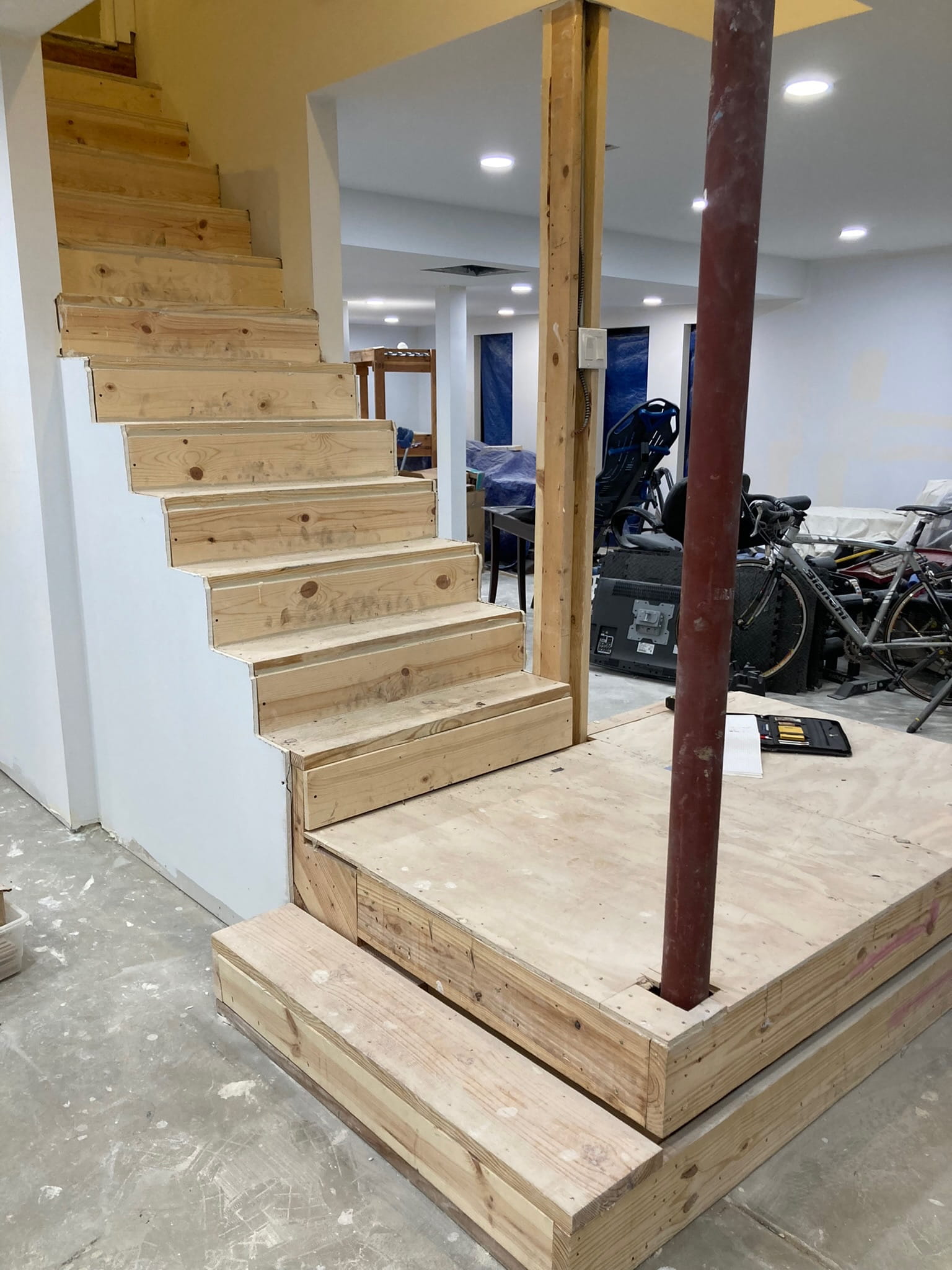 Before: unfinished stair structure before trim work