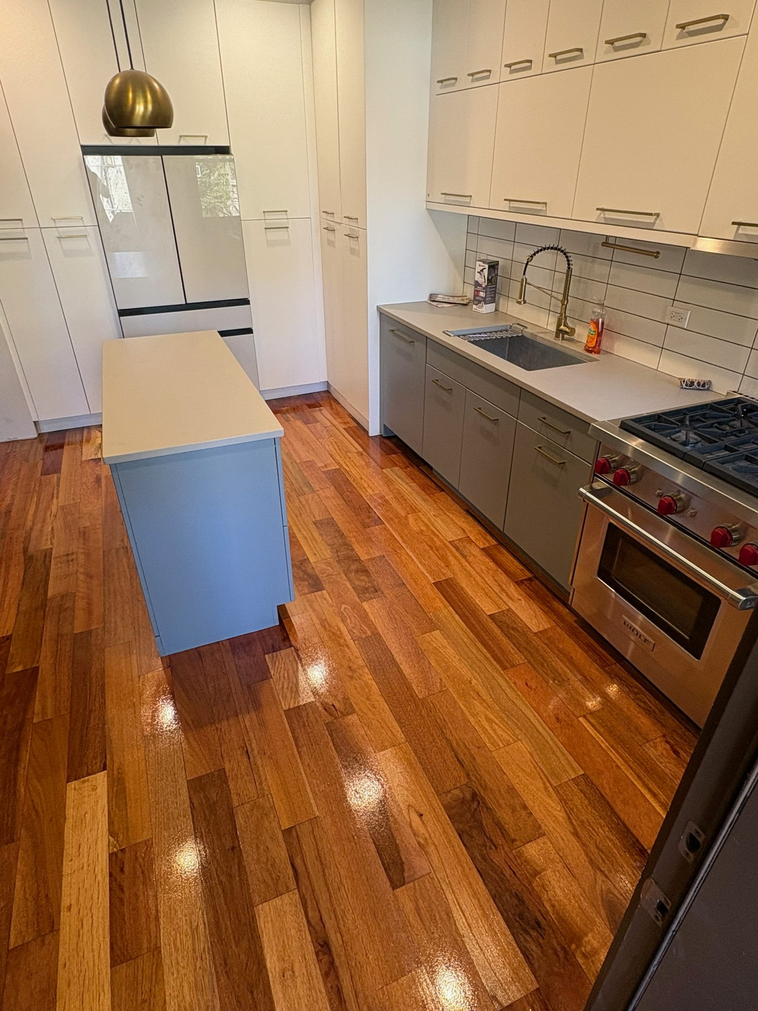 High-gloss hardwood floor in kitchen and dining area